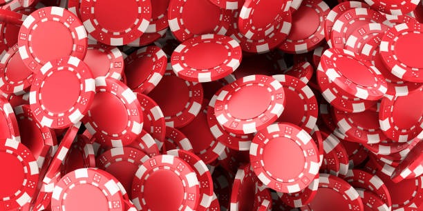 Mobile phone displaying AduQ betting buttons and chip stack on juragan55